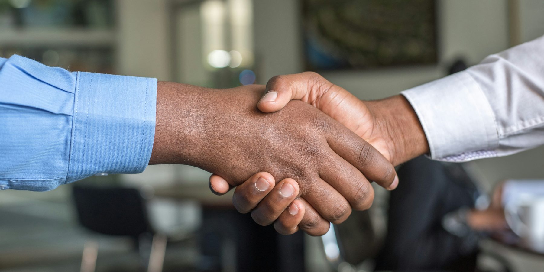 Business partners shaking hands after a supply agreement